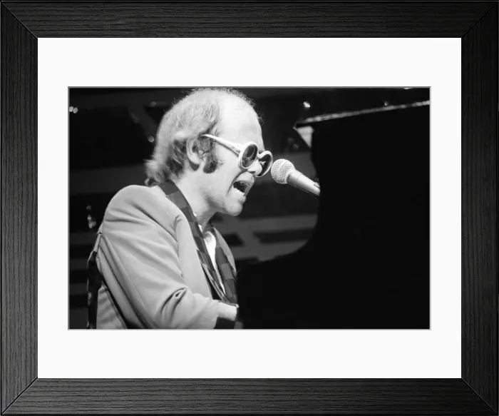 Framed Print : Elton John performing on stage, during the Elton John and Ray Cooper concert tours Framed Print : Elton John performing on stage, during the Elton John and Ray Cooper concert tours