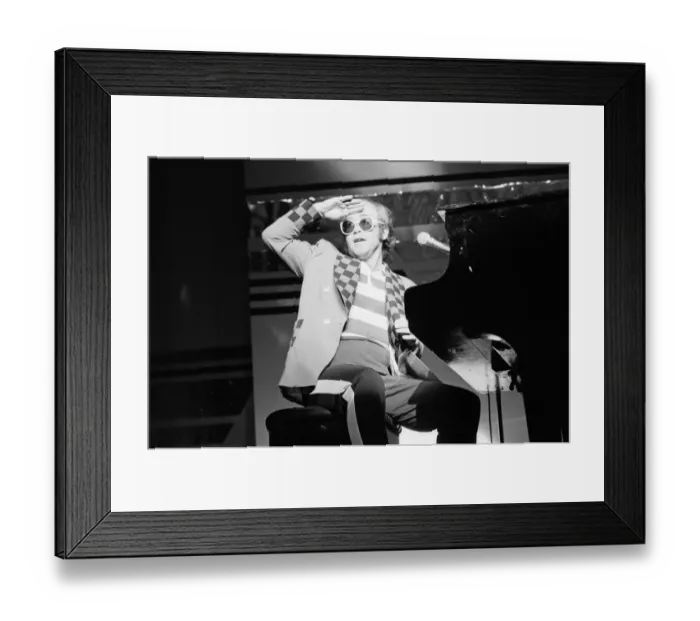 Framed Print : Elton John performing on stage, during the Elton John and Ray Cooper concert tours Framed Print : Elton John performing on stage, during the Elton John and Ray Cooper concert tours