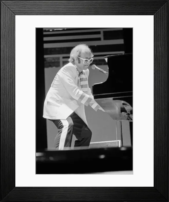 Framed Print : Elton John performing on stage, during the Elton John and Ray Cooper concert tours Framed Print : Elton John performing on stage, during the Elton John and Ray Cooper concert tours
