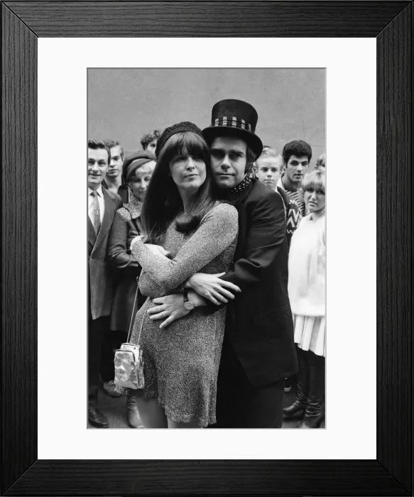 Framed Print : Wearing a top hat, Elton John, at a small studio in Ladbroke Grove to make a promotional