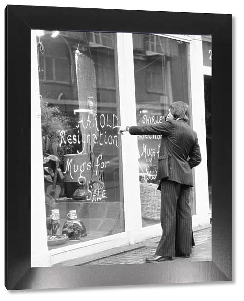 Shoppers in Crawford Street, Marylebone, London looks at the window display of Briglin