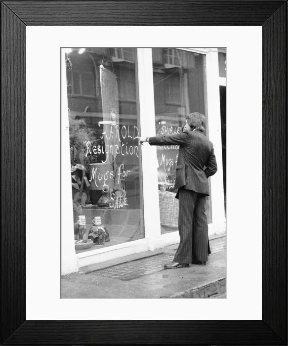 Framed Print : Shoppers in Crawford Street, Marylebone, London looks at the window display of Briglin Framed Print : Shoppers in Crawford Street, Marylebone, London looks at the window display of Briglin