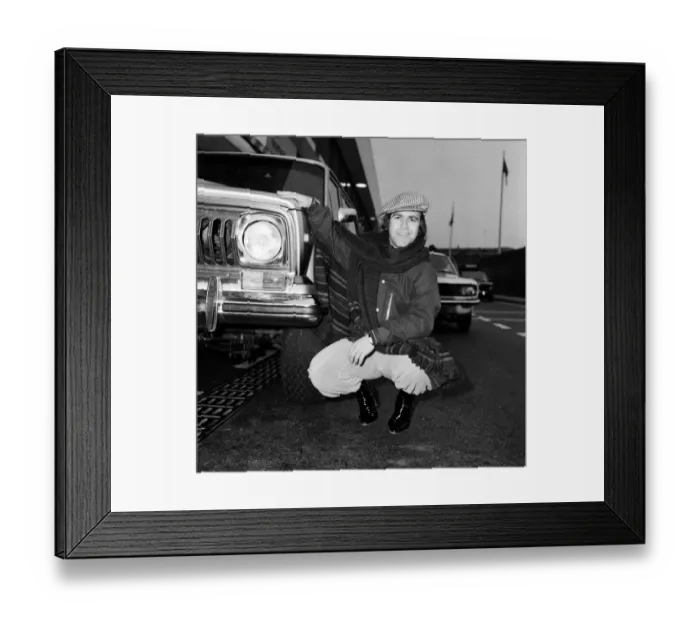 Framed Print : Elton John pictured next to an American Jeep at London Airport. February 1979 Framed Print : Elton John pictured next to an American Jeep at London Airport. February 1979