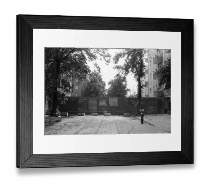 Framed Print : The Berlin Wall. The wall running into houses on either side of the road Framed Print : The Berlin Wall. The wall running into houses on either side of the road