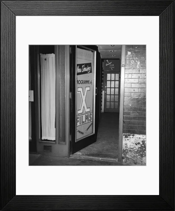 Framed Print : The Amber Film Club on Frith Street in Soho, London, showcasing X Rated adult french