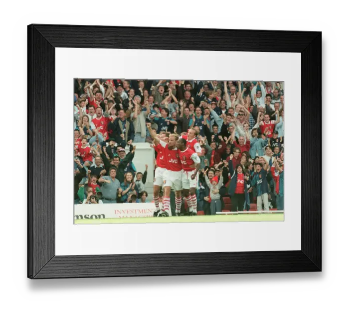 Framed Print : Dennis Bergkamp celebrates his first ever goal for his new club Arsenal