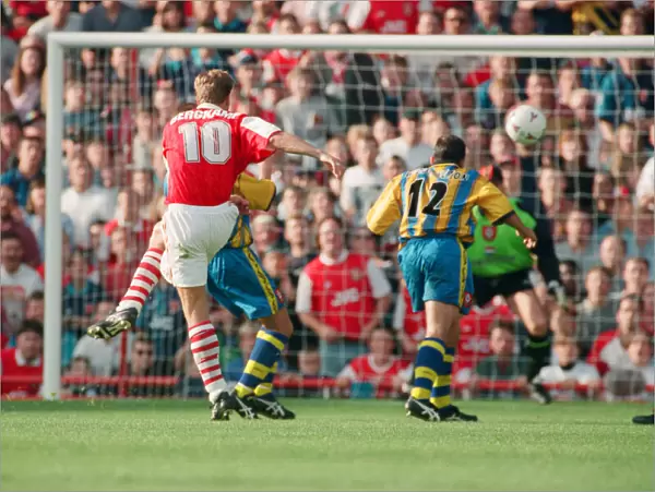 Dennis Bergkamp scores his second goal for his new club Arsenal