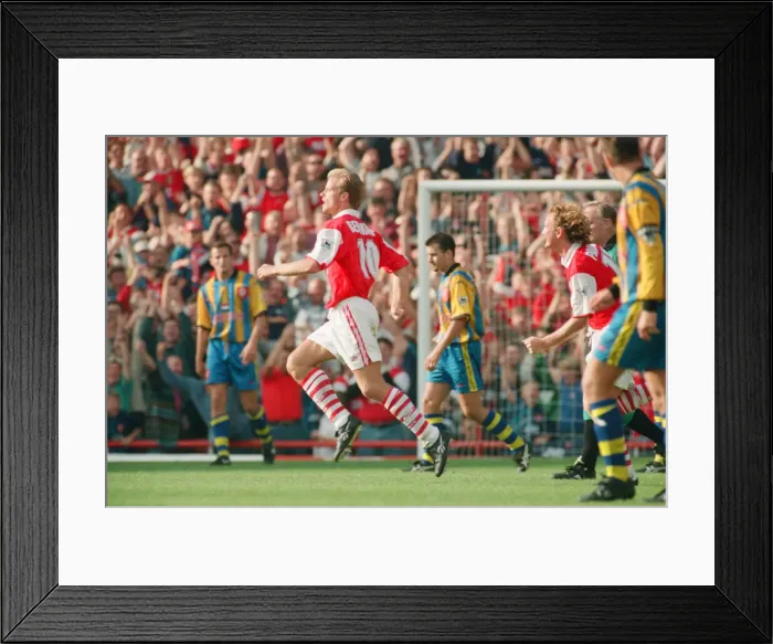 Framed Print : Dennis Bergkamp celebrates his second goal for his new club Arsenal Framed Print : Dennis Bergkamp celebrates his second goal for his new club Arsenal