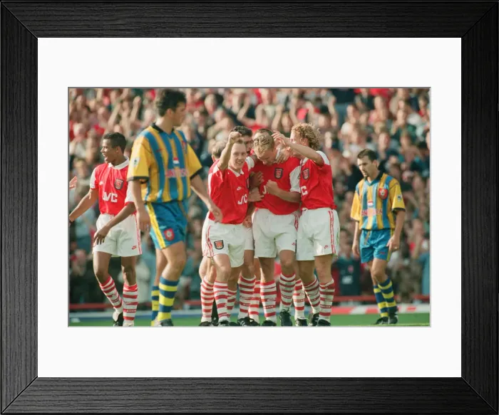 Framed Print : Dennis Bergkamp celebrates his second goal for his new club Arsenal