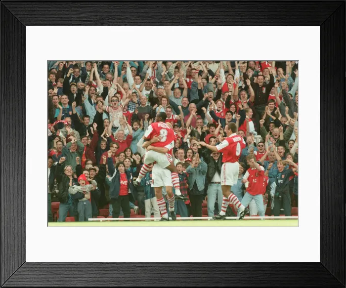 Framed Print : Dennis Bergkamp celebrates his first ever goal for his new club Arsenal Framed Print : Dennis Bergkamp celebrates his first ever goal for his new club Arsenal