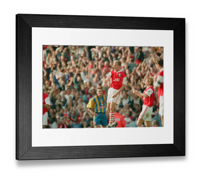Framed Print : Dennis Bergkamp celebrates his second goal for his new club Arsenal