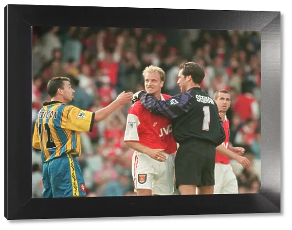 Dennis Bergkamp is congratulated by Arsenal goalkeeper David Seaman as they celebrate