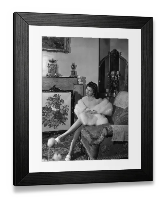 Framed Print : Simone Silva, french actress, poses for pictures at home Stafford Court, Kensington