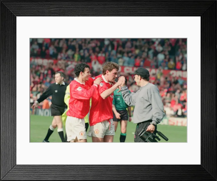 Framed Print : Steve Bruce, congratulated by Ryan Giggs (number 11) pictured at the end of the match Framed Print : Steve Bruce, congratulated by Ryan Giggs (number 11) pictured at the end of the match