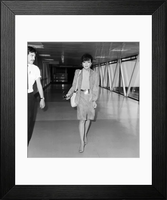 Framed Print : Actress Joan Collins at an airport. May 1982 Framed Print : Actress Joan Collins at an airport. May 1982