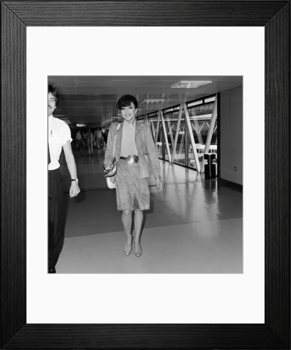 Framed Print : Actress Joan Collins at an airport. May 1982 Framed Print : Actress Joan Collins at an airport. May 1982