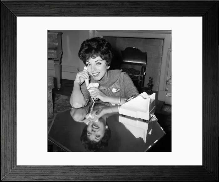 Framed Print : Film star Joan Collins flew into London today from Montego Bay