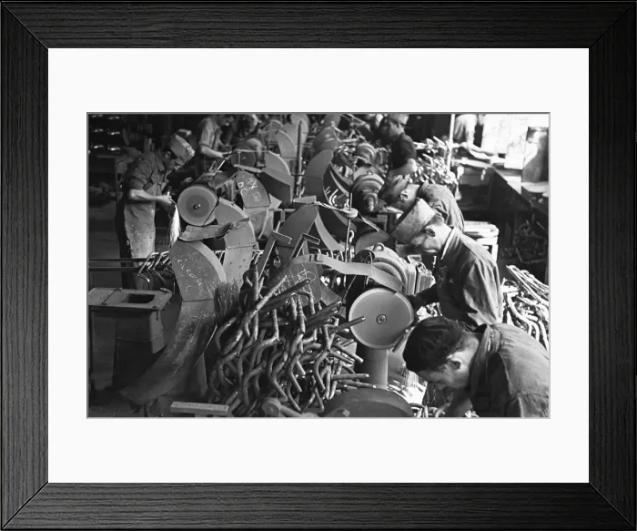 Framed Print : Workers on the production line at the Bianchi motorcycle factory in Milan producing