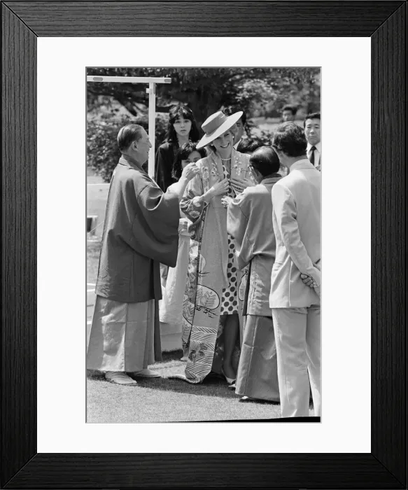 Framed Print : HRH Princess Diana, The Princess of Wales, is helped by city officials to wear a Framed Print : HRH Princess Diana, The Princess of Wales, is helped by city officials to wear a