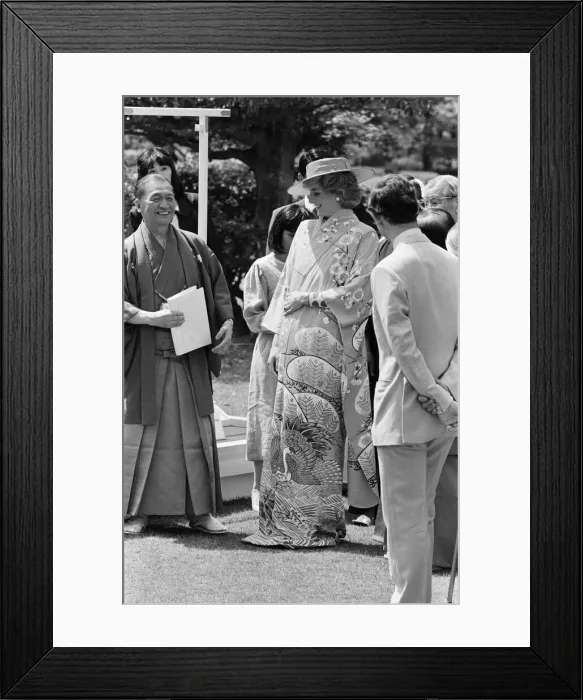 Framed Print : HRH Princess Diana, The Princess of Wales, is helped by city officials to wear a