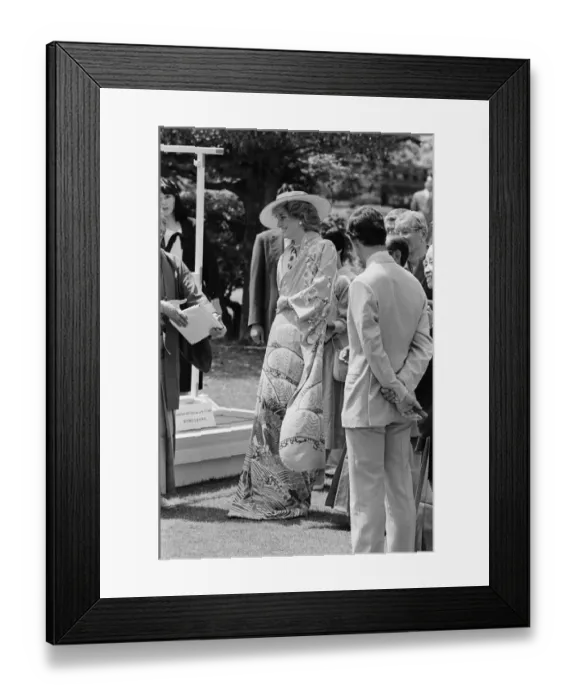 Framed Print : HRH Princess Diana, The Princess of Wales, is helped by city officials to wear a Framed Print : HRH Princess Diana, The Princess of Wales, is helped by city officials to wear a