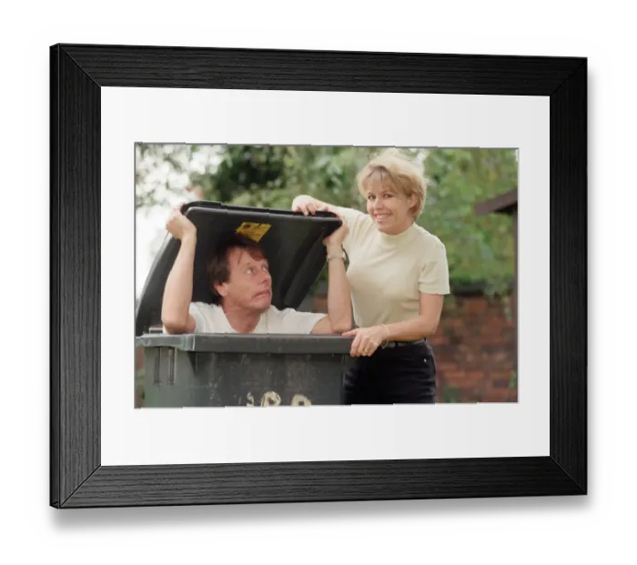 Framed Print : Radio WM presenters, Tony Wadsworth in a wheelie bin and Julie Mayer. 17th October 1997