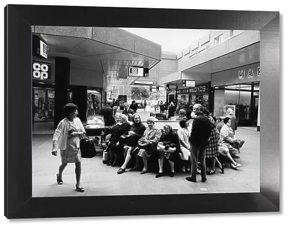 Shoppers sit, relax and chat at the Salford City Shopping Centre. June 1972
