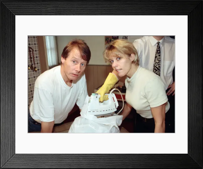 Framed Print : Radio WM presenters Tony Wadsworth and Julie Mayer pictured with an iron