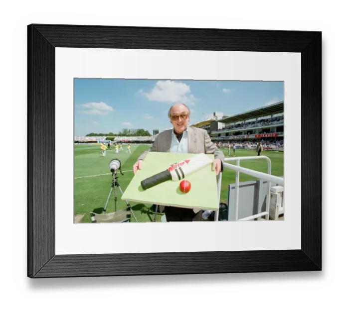 Framed Print : Cricket commentator Henry Blofeld is presented with a Daily Mirror cake in the shape of a Framed Print : Cricket commentator Henry Blofeld is presented with a Daily Mirror cake in the shape of a