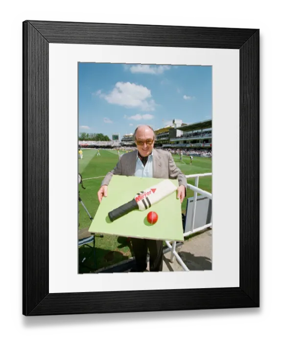 Framed Print : Cricket commentator Henry Blofeld is presented with a Daily Mirror cake in the shape of a