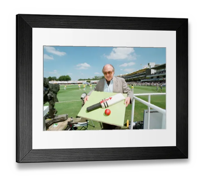 Framed Print : Cricket commentator Henry Blofeld is presented with a Daily Mirror cake in the shape of a Framed Print : Cricket commentator Henry Blofeld is presented with a Daily Mirror cake in the shape of a