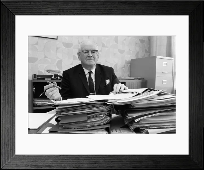 Framed Print : Mr Eric Jackson, deputy town clerk of Irlam UDC, amongst the files of his campaign Framed Print : Mr Eric Jackson, deputy town clerk of Irlam UDC, amongst the files of his campaign