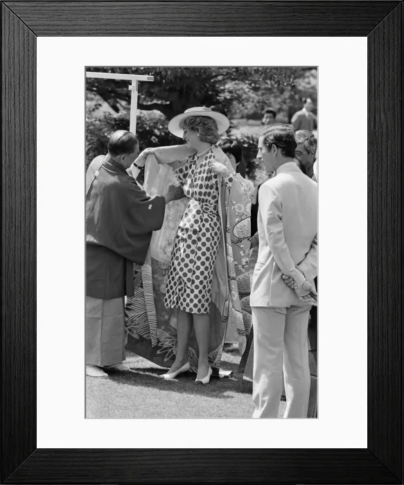 Framed Print : HRH Princess Diana, The Princess of Wales, is helped by city officials to wear a