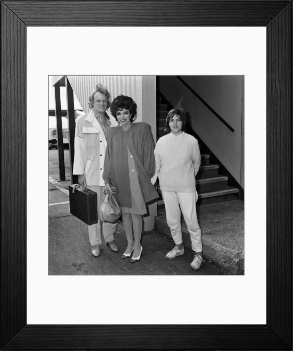 Framed Print : Joan Collins arrives at LAP from Los Angeles with her boyfriend Peter Holm