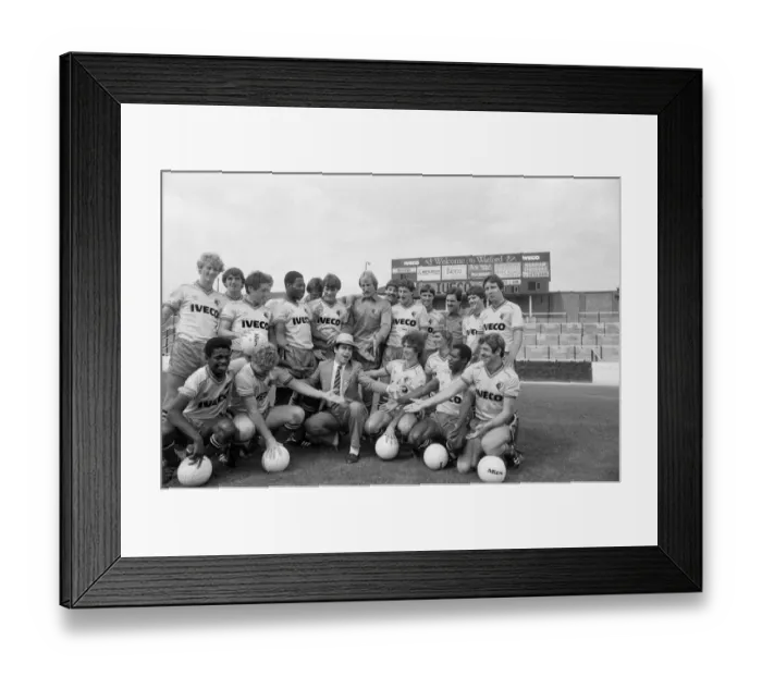Framed Print : Watford FC chairman Elton John with Watford football team at a photocall