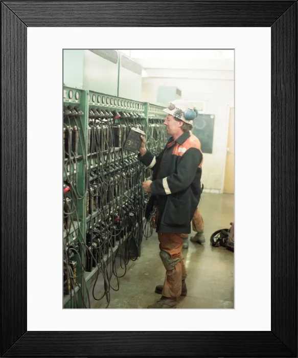 Framed Print : A miner returns his lamp to the lamp room for the final time as the last shift Framed Print : A miner returns his lamp to the lamp room for the final time as the last shift