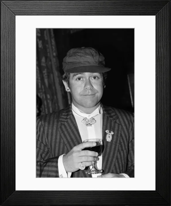 Framed Print : Elton John attends a House of Commons reception, invited along with other pop stars by Framed Print : Elton John attends a House of Commons reception, invited along with other pop stars by