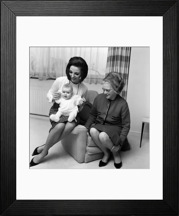 Framed Print : Joan Collins pictured with her four-month-old daughter Tara Newley