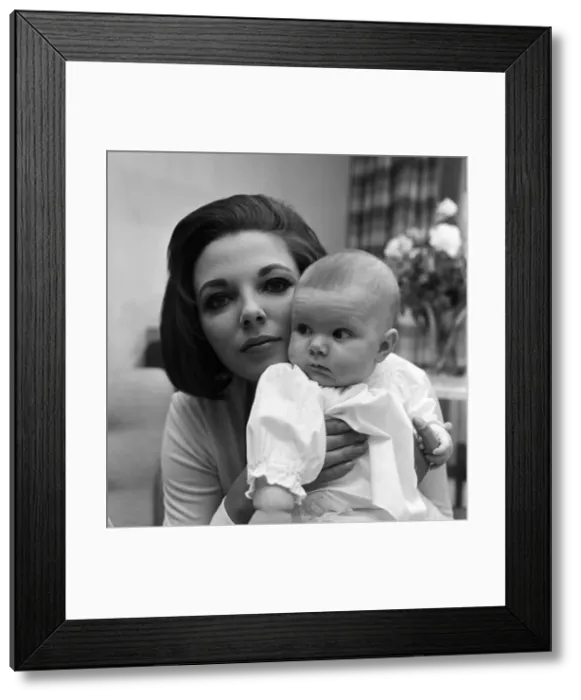 Framed Print : Joan Collins pictured with her four-month-old daughter Tara Newley Framed Print : Joan Collins pictured with her four-month-old daughter Tara Newley
