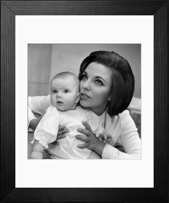 Framed Print : Joan Collins pictured with her four-month-old daughter Tara Newley