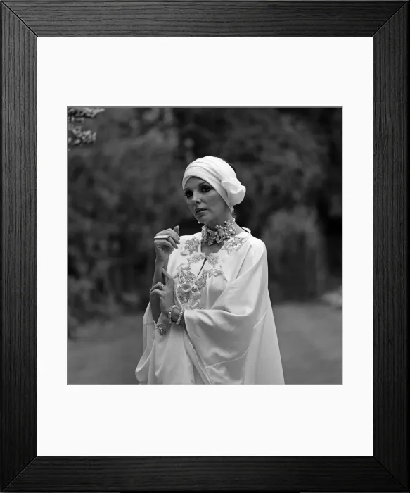 Framed Print : Actress Joan Collins modelling outfits that she will wear on a trip to Tokyo to judge a Framed Print : Actress Joan Collins modelling outfits that she will wear on a trip to Tokyo to judge a