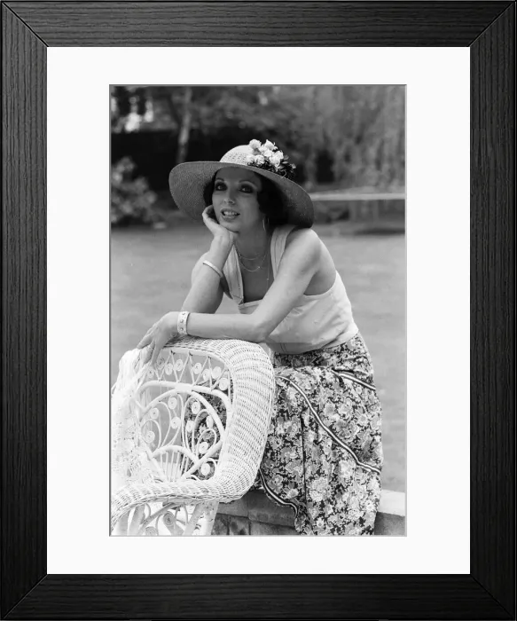 Framed Print : Actress Joan Collins modelling outfits that she will wear on a trip to Tokyo to judge a Framed Print : Actress Joan Collins modelling outfits that she will wear on a trip to Tokyo to judge a
