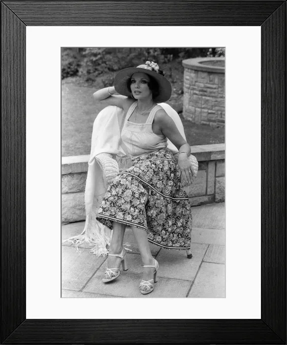 Framed Print : Actress Joan Collins modelling outfits that she will wear on a trip to Tokyo to judge a Framed Print : Actress Joan Collins modelling outfits that she will wear on a trip to Tokyo to judge a