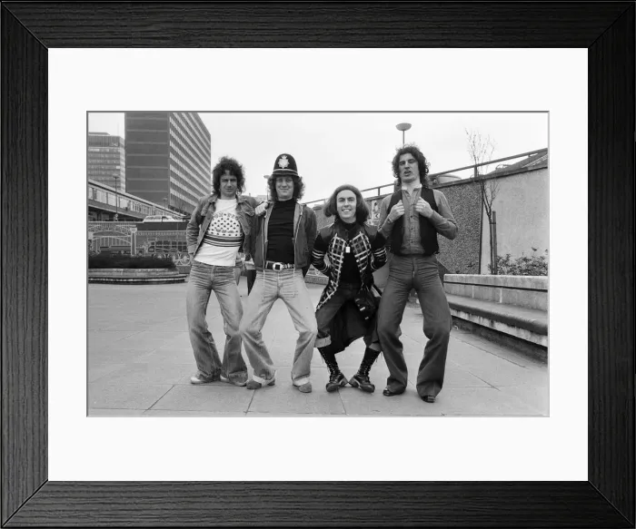 Framed Print : Glam rock group Slade posing for pictures in Birmingham City Centre. 25th March 1977 Framed Print : Glam rock group Slade posing for pictures in Birmingham City Centre. 25th March 1977