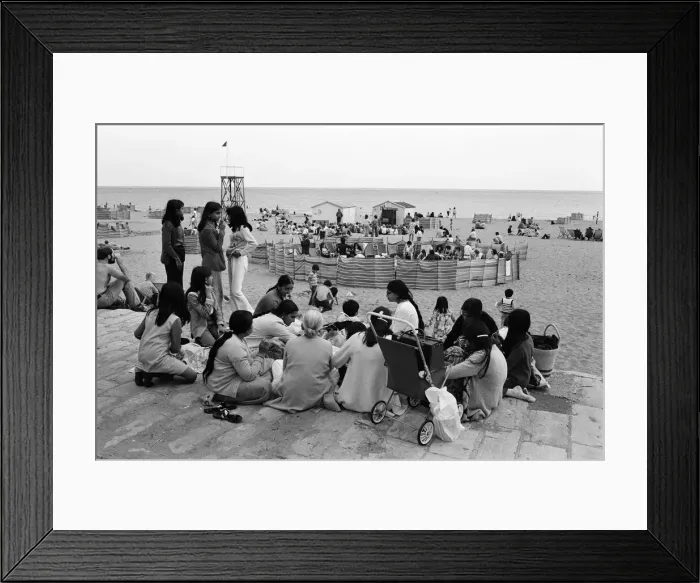 Framed Print : Beach scenes in Ramsgate. Holidaymakers in a village circle Framed Print : Beach scenes in Ramsgate. Holidaymakers in a village circle