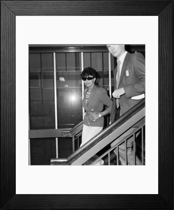 Framed Print : Joan Collins with her son Sacha, 17, arriving at Heathrow from Los Angeles Framed Print : Joan Collins with her son Sacha, 17, arriving at Heathrow from Los Angeles