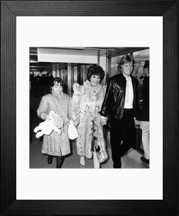Framed Print : Joan Collins with daughter Katyana Kass and boyfriend Peter Holm at Heathrow after Framed Print : Joan Collins with daughter Katyana Kass and boyfriend Peter Holm at Heathrow after
