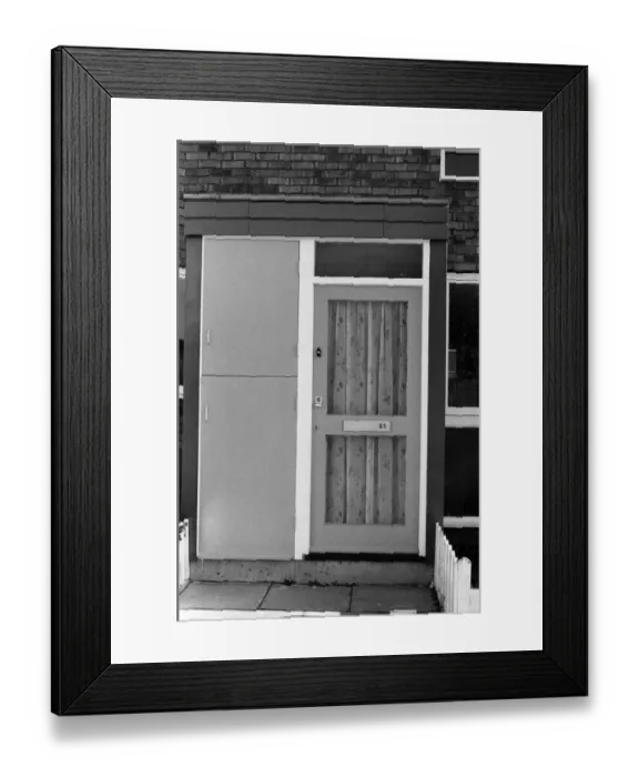 Framed Print : Painted council houses and the unpainted ones - part of a battle of home buying at a