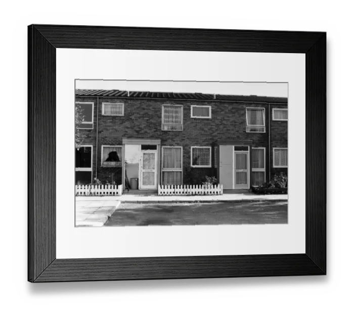 Framed Print : Painted council houses and the unpainted ones - part of a battle of home buying at a Framed Print : Painted council houses and the unpainted ones - part of a battle of home buying at a