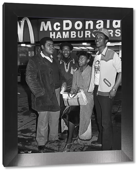 Young people standing outside McDonalds. 3rd April 1980
